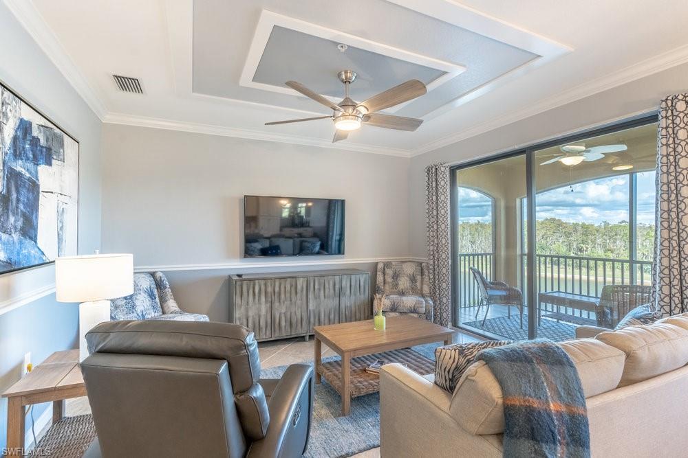 9578 Trevi Court, Unit 5142 Naples, FL 34113 - Photo 9 of 49 a living room with furniture and a window