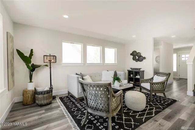 a dining room with furniture and wooden floor