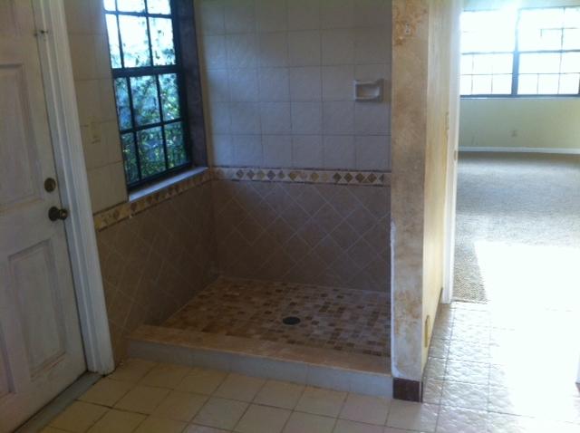 2298 Northwest 35th Street Boca Raton, FL 33431 - Photo 18 of 26 a bathroom with a glass shower door