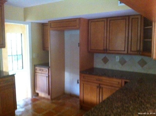 2298 Northwest 35th Street Boca Raton, FL 33431 - Photo 5 of 26 a area with wooden cabinets