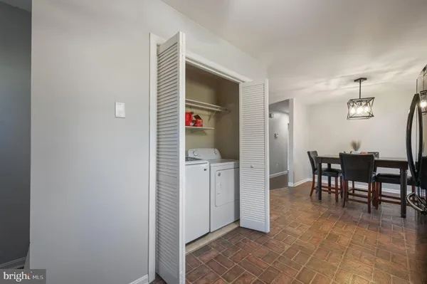 a view of a kitchen from the hallway