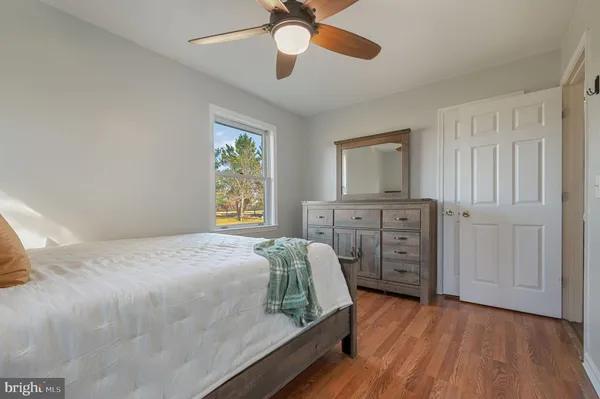 a bedroom with a bed and a dresser