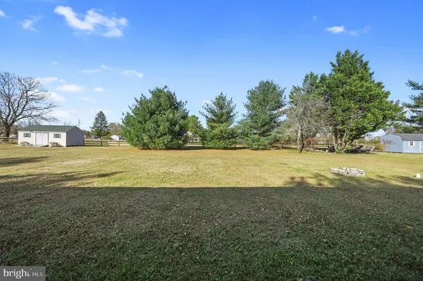 a view of an ocean and yard