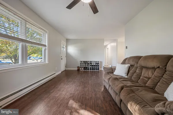 a living room with furniture and a large window