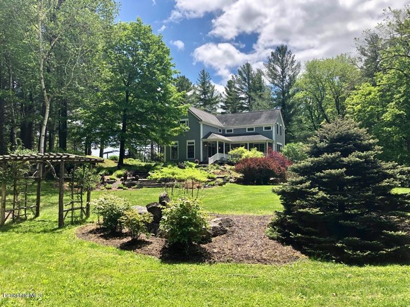 674 Foley Road Sheffield, MA 01257 - Photo 1 of 30 a view of backyard with table and chairs and potted plants and large trees