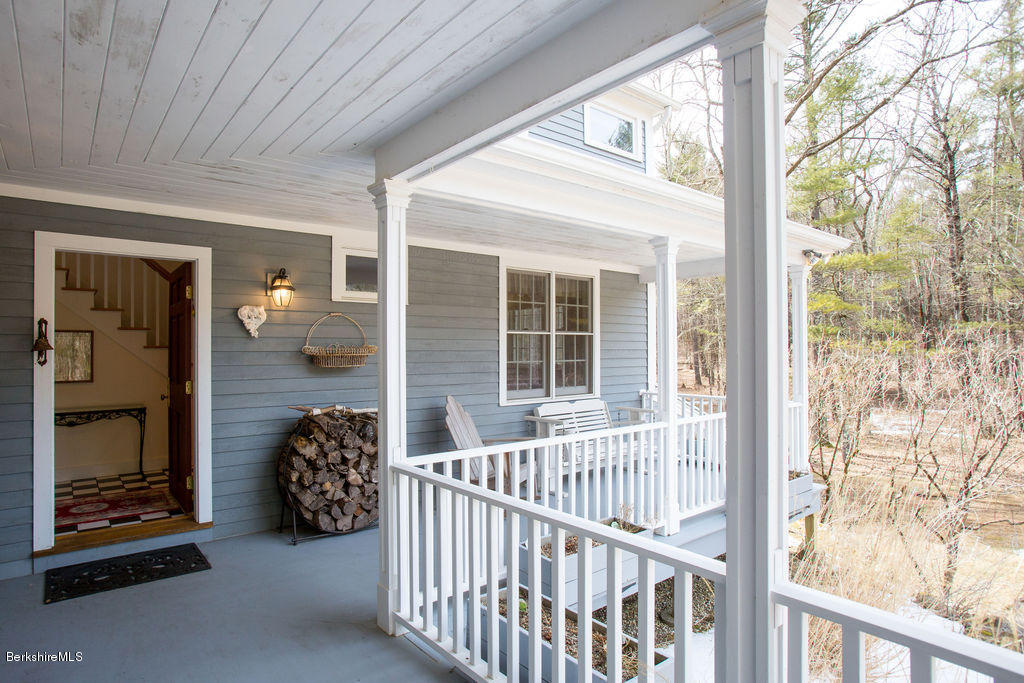 674 Foley Road Sheffield, MA 01257 - Photo 3 of 30 a view of a balcony with chair and the porch