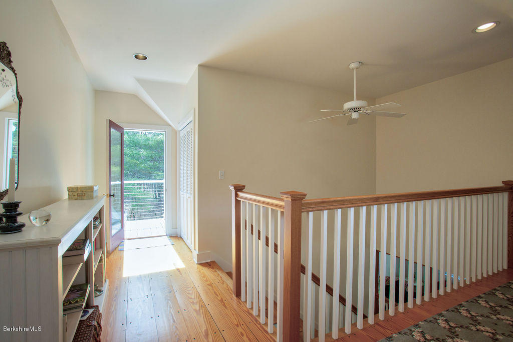 674 Foley Road Sheffield, MA 01257 - Photo 22 of 30 a view of a hallway with workspace and wooden floor