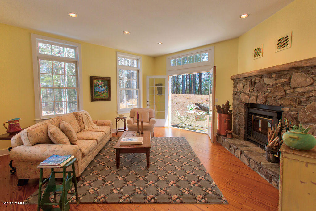 674 Foley Road Sheffield, MA 01257 - Photo 5 of 30 a living room with furniture a fireplace and a table
