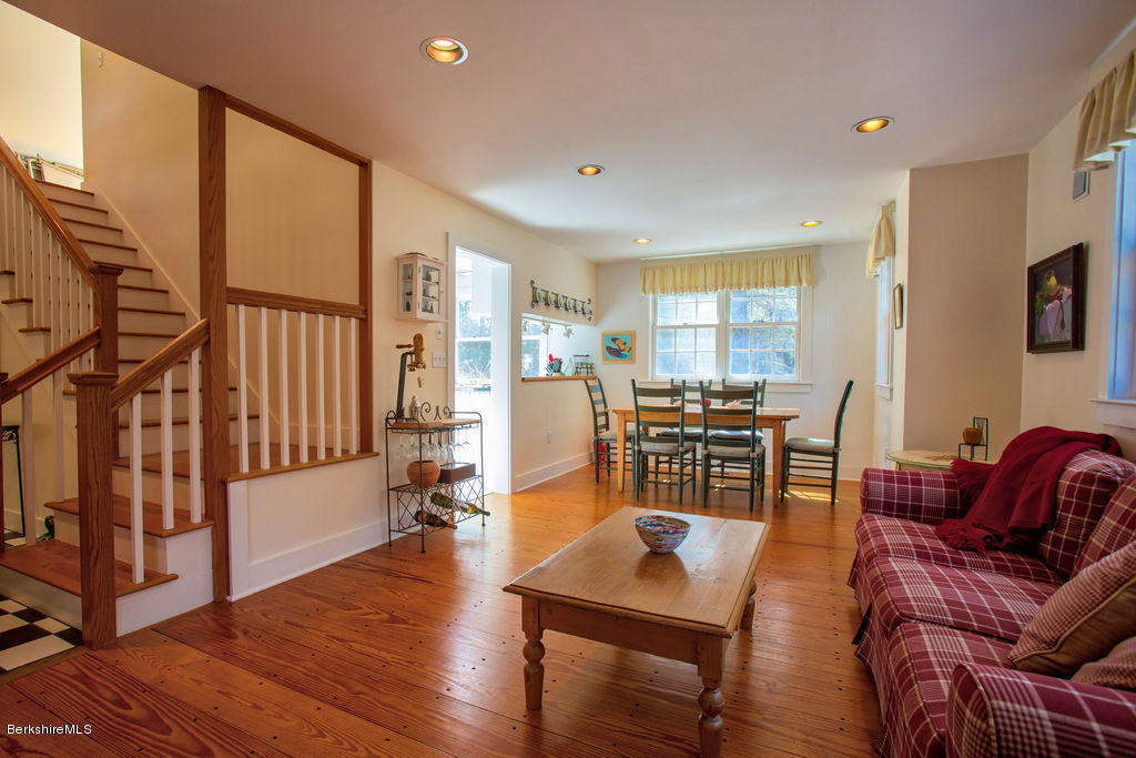 674 Foley Road Sheffield, MA 01257 - Photo 8 of 30 a living room with furniture a flat screen tv and wooden floor