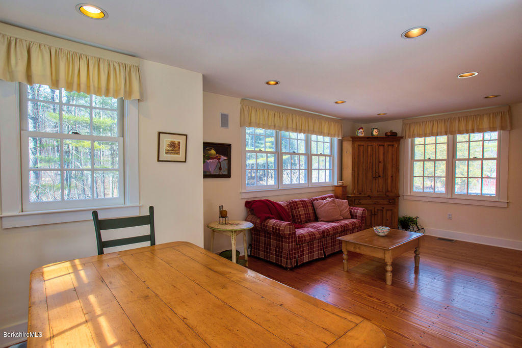 674 Foley Road Sheffield, MA 01257 - Photo 9 of 30 a bedroom with furniture window and wooden floor