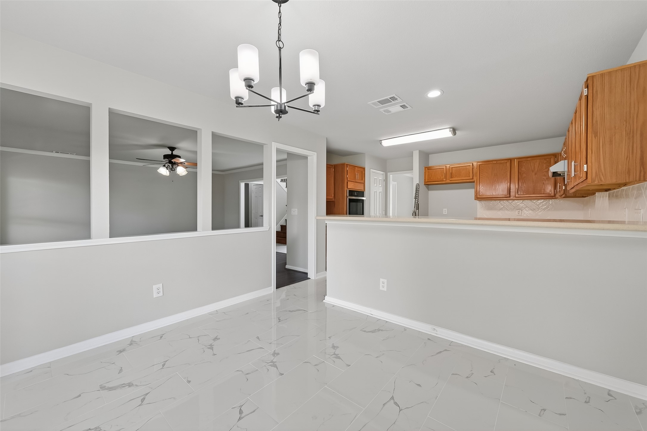 18058 Golden Ridge Drive Houston, TX 77084 - Photo 11 of 35 a view of a kitchen and a window