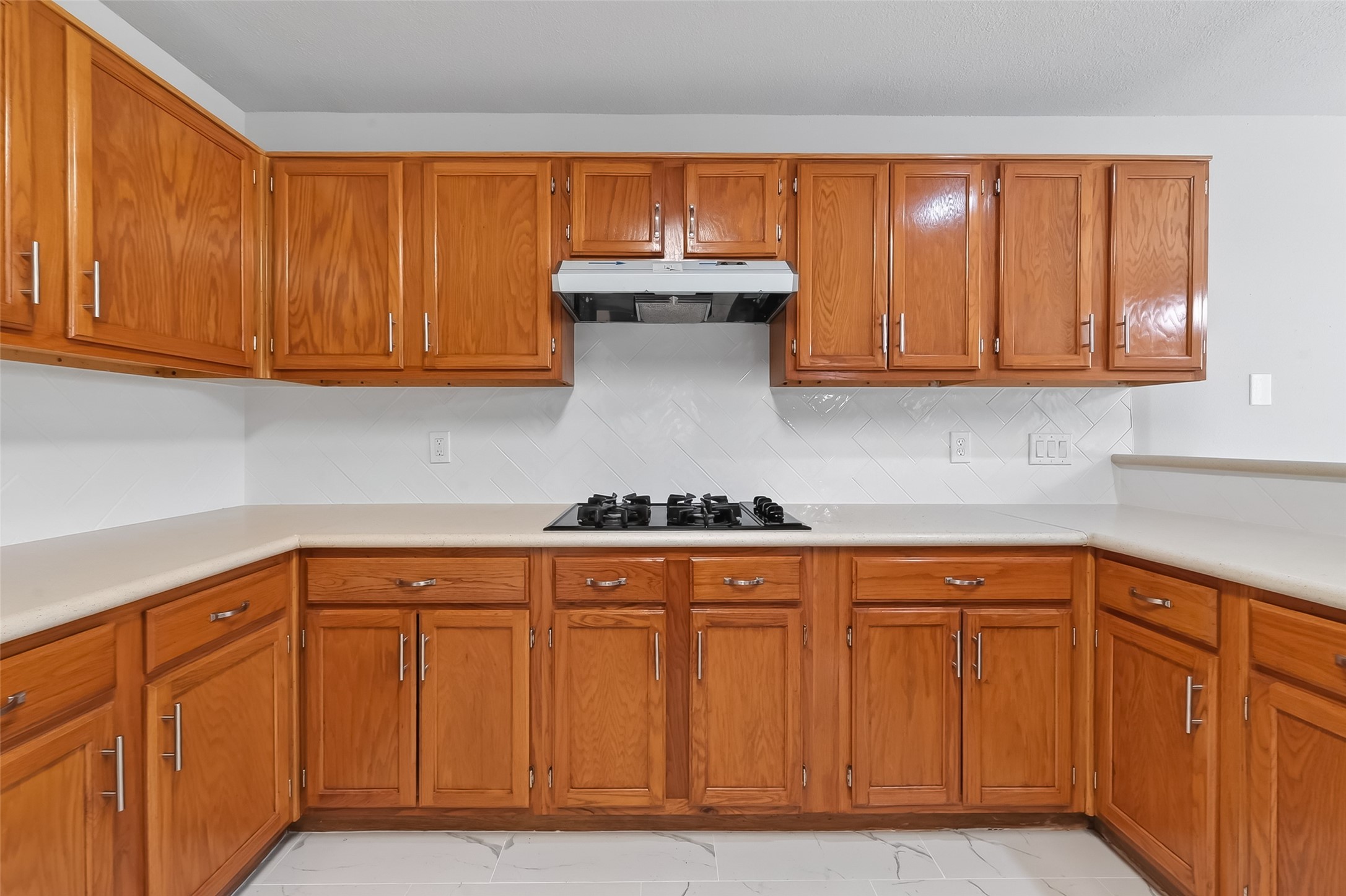 18058 Golden Ridge Drive Houston, TX 77084 - Photo 16 of 35 a kitchen with granite countertop cabinets and a sink