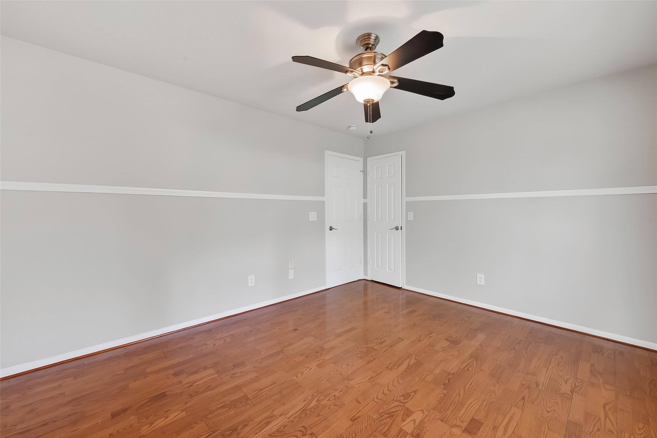 18058 Golden Ridge Drive Houston, TX 77084 - Photo 32 of 35 an empty room with a fan and a window
