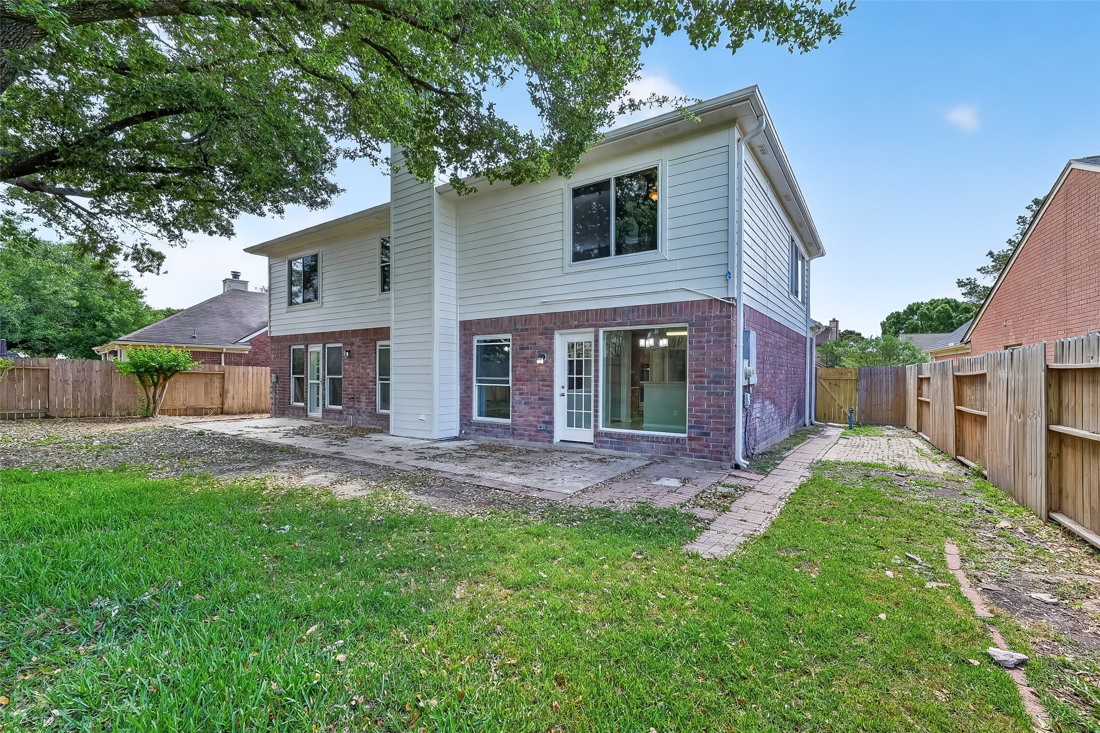 18058 Golden Ridge Drive Houston, TX 77084 - Photo 35 of 35 a front view of a house with a garden and yard