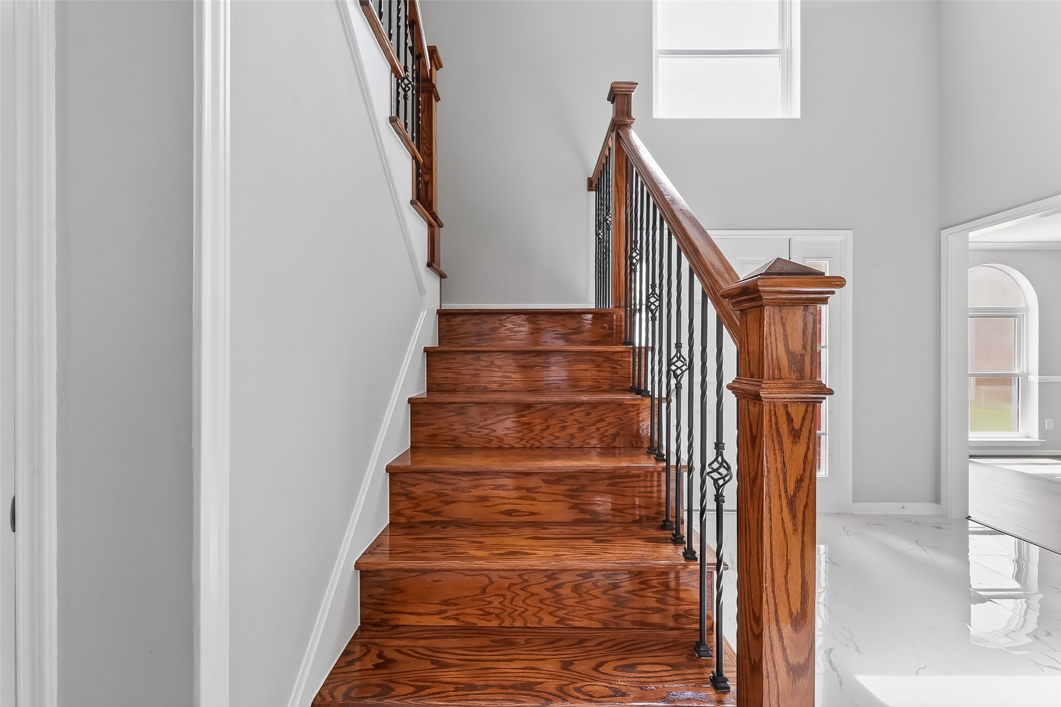 18058 Golden Ridge Drive Houston, TX 77084 - Photo 4 of 35 a view of entryway with wooden floor and stairs
