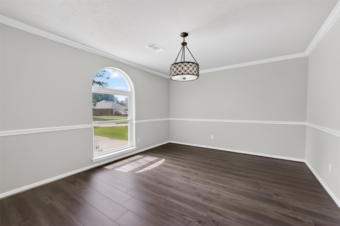 18058 Golden Ridge Drive Houston, TX 77084 - Photo 5 of 35 a view of empty room with wooden floor and fan