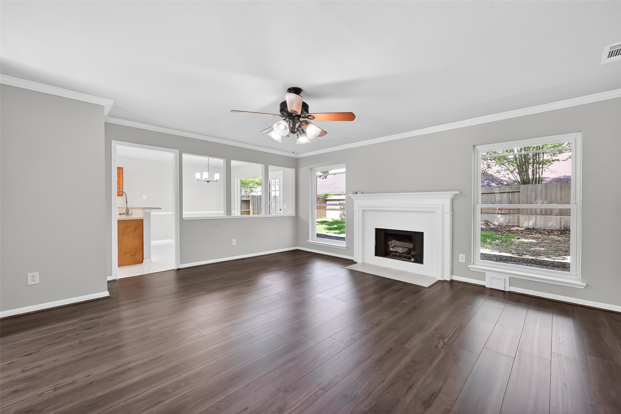 18058 Golden Ridge Drive Houston, TX 77084 - Photo 7 of 35 a view of an empty room with wooden floor and a window