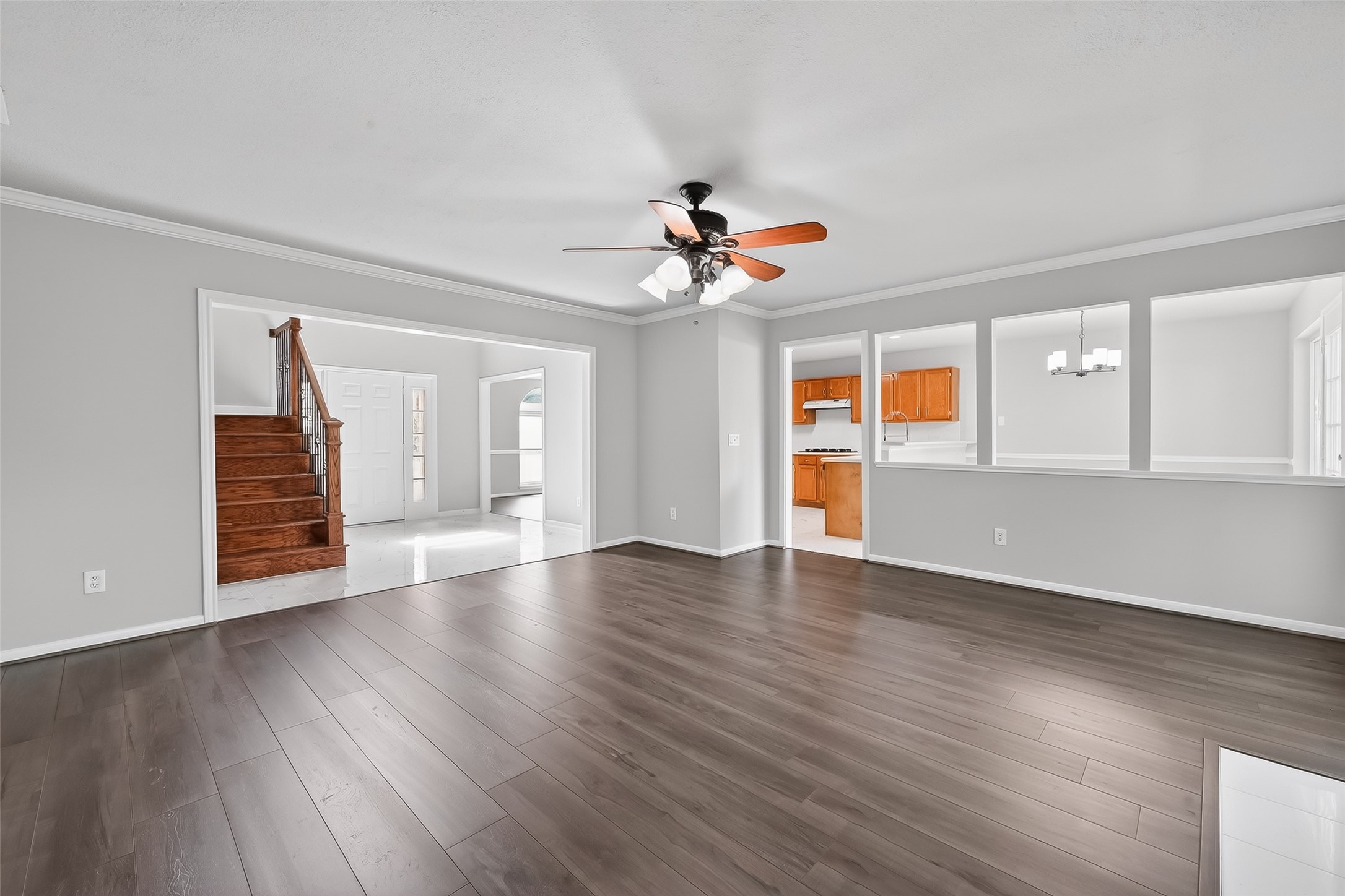 18058 Golden Ridge Drive Houston, TX 77084 - Photo 8 of 35 a view of an empty room with window and wooden floor