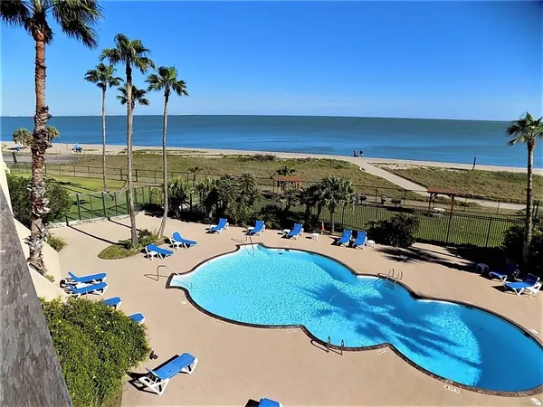 a view of a swimming pool with a patio