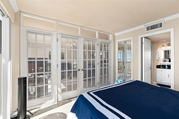 a room with windows and wooden floor