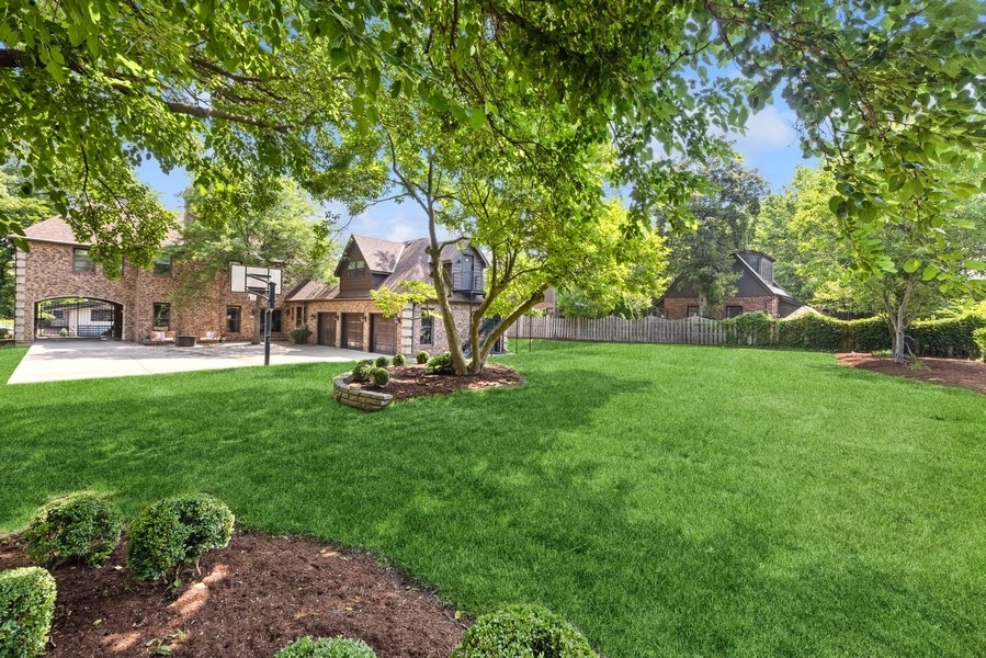 950 Taft Road Hinsdale, IL 60521 - Photo 3 of 58 a view of playground with a garden and entertaining space