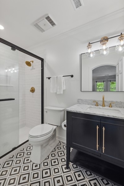 950 Taft Road Hinsdale, IL 60521 - Photo 41 of 58 a spacious bathroom with a sink toilet a mirror and shower