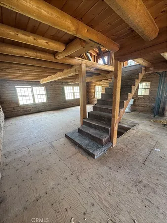 a view of an empty room with stairs