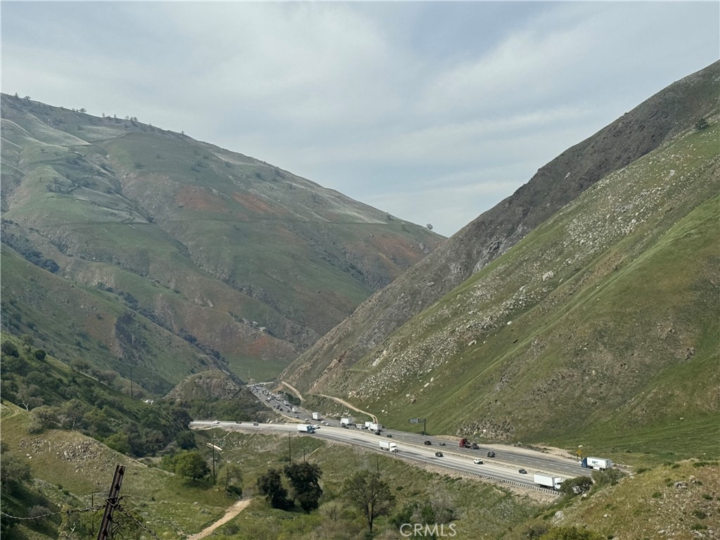 7700 Digier Road Lebec, CA 93243 - Photo 25 of 30 a view of a dry yard with mountains in the background