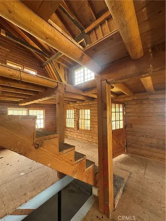 a view of a hall with wooden floor