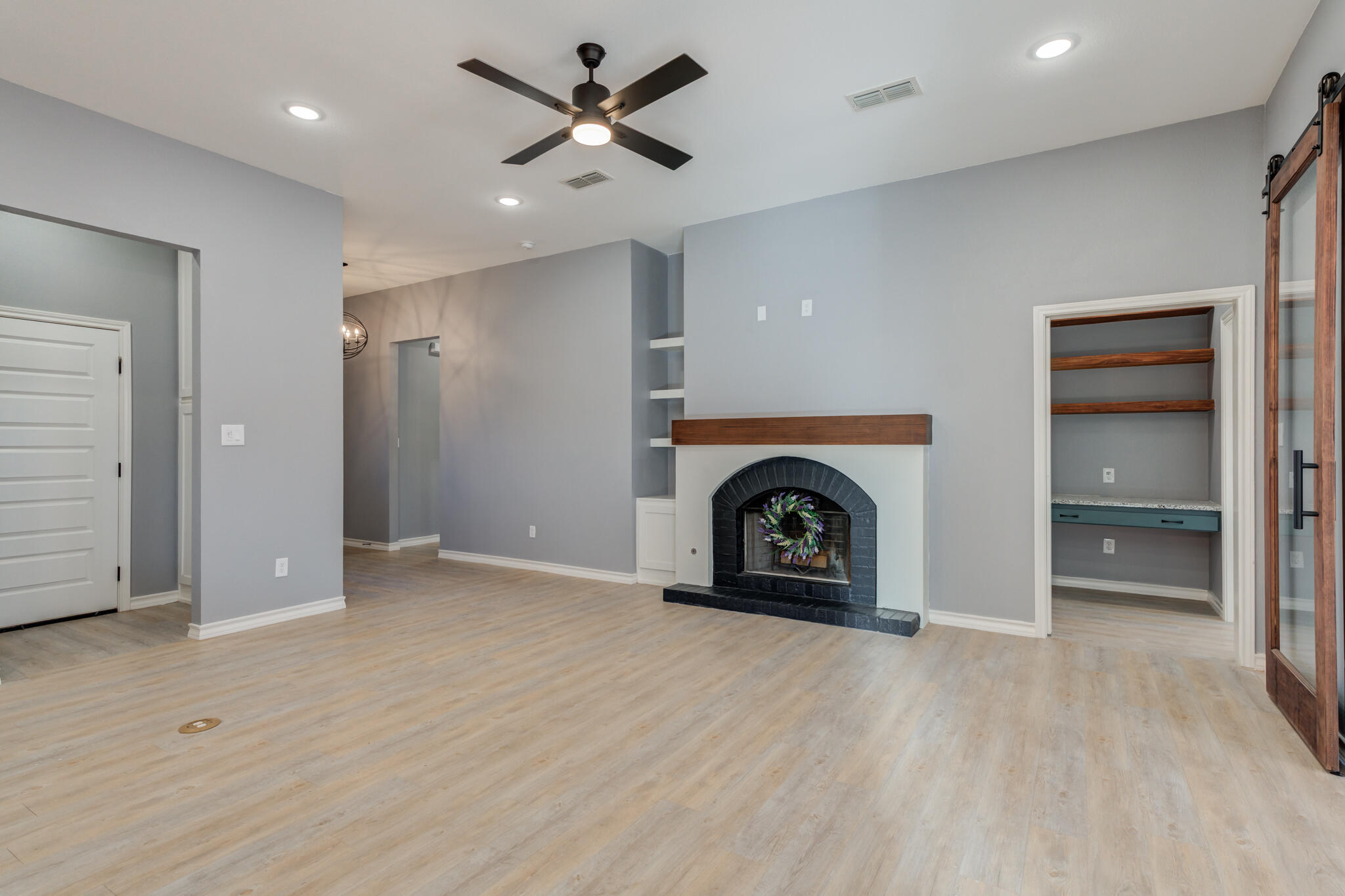12701 Kenosha Avenue Lubbock, TX 79423 - Photo 12 of 61 an empty room with closet and a fireplace