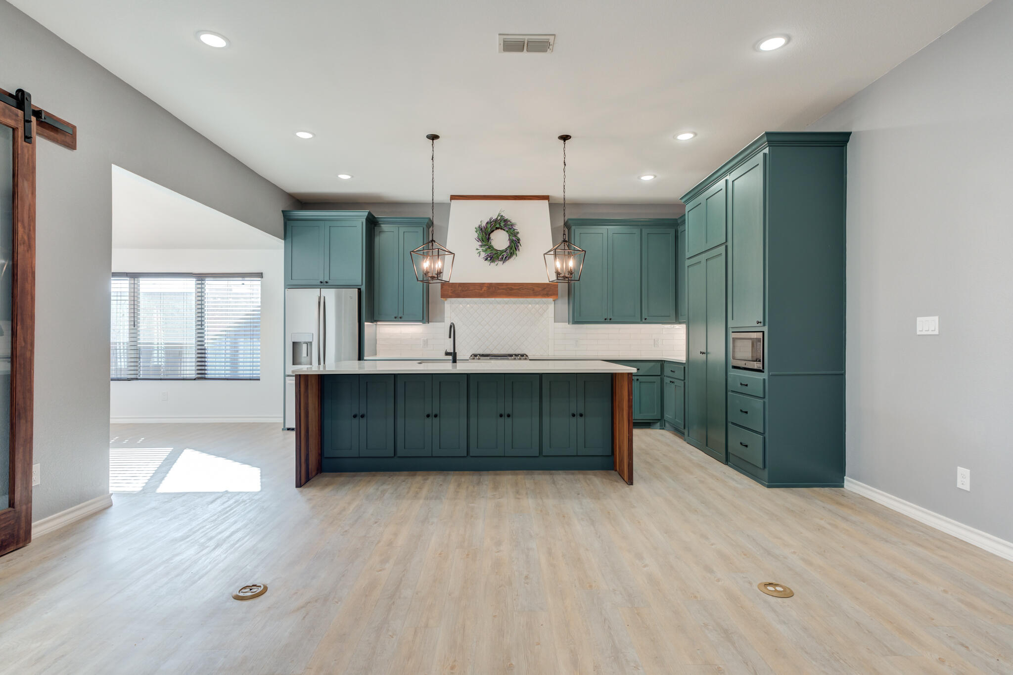 12701 Kenosha Avenue Lubbock, TX 79423 - Photo 15 of 61 a large bathroom with a large mirror vanity and a sink