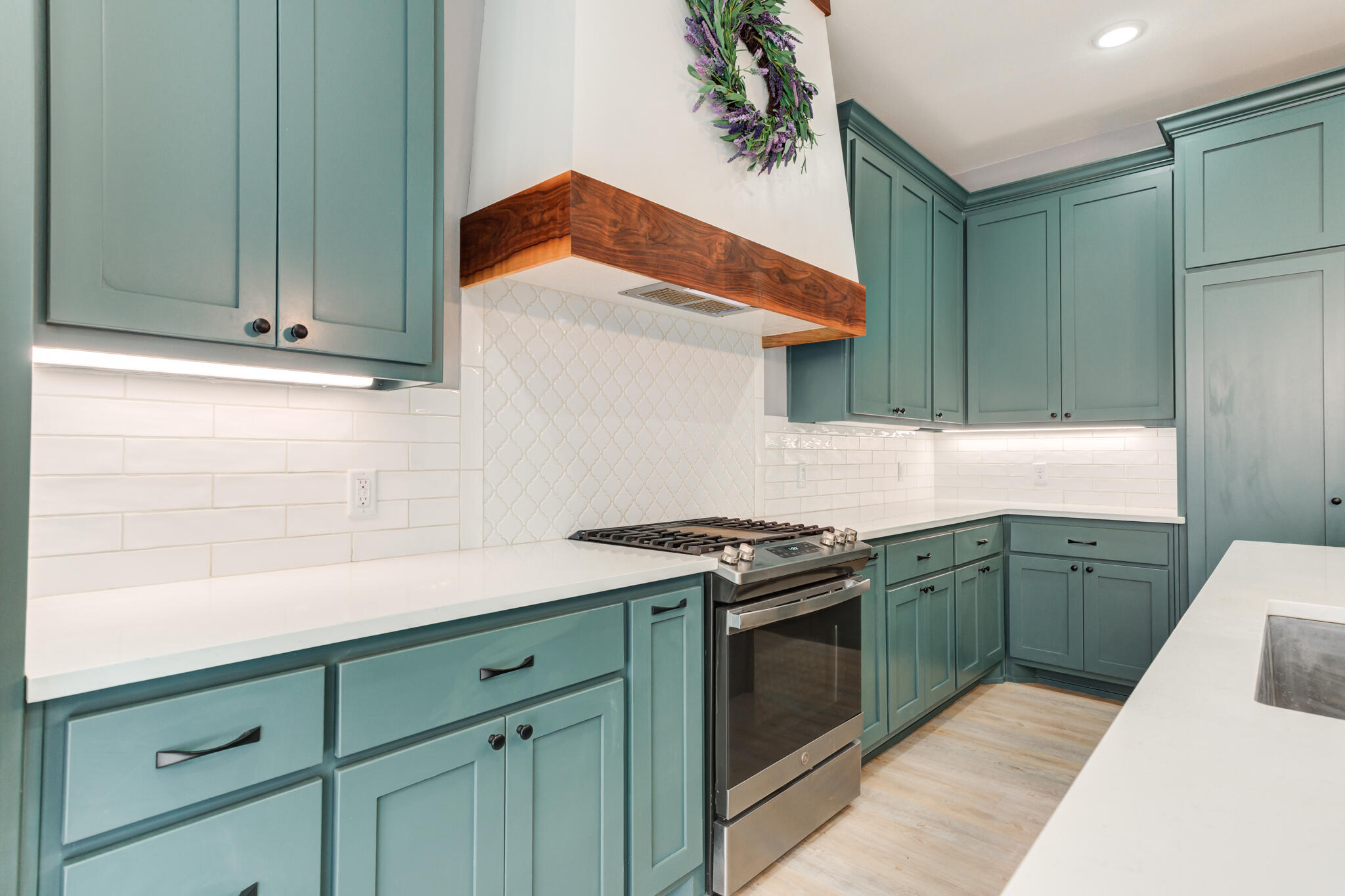 12701 Kenosha Avenue Lubbock, TX 79423 - Photo 20 of 61 a kitchen with granite countertop cabinets stainless steel appliances and wooden floor