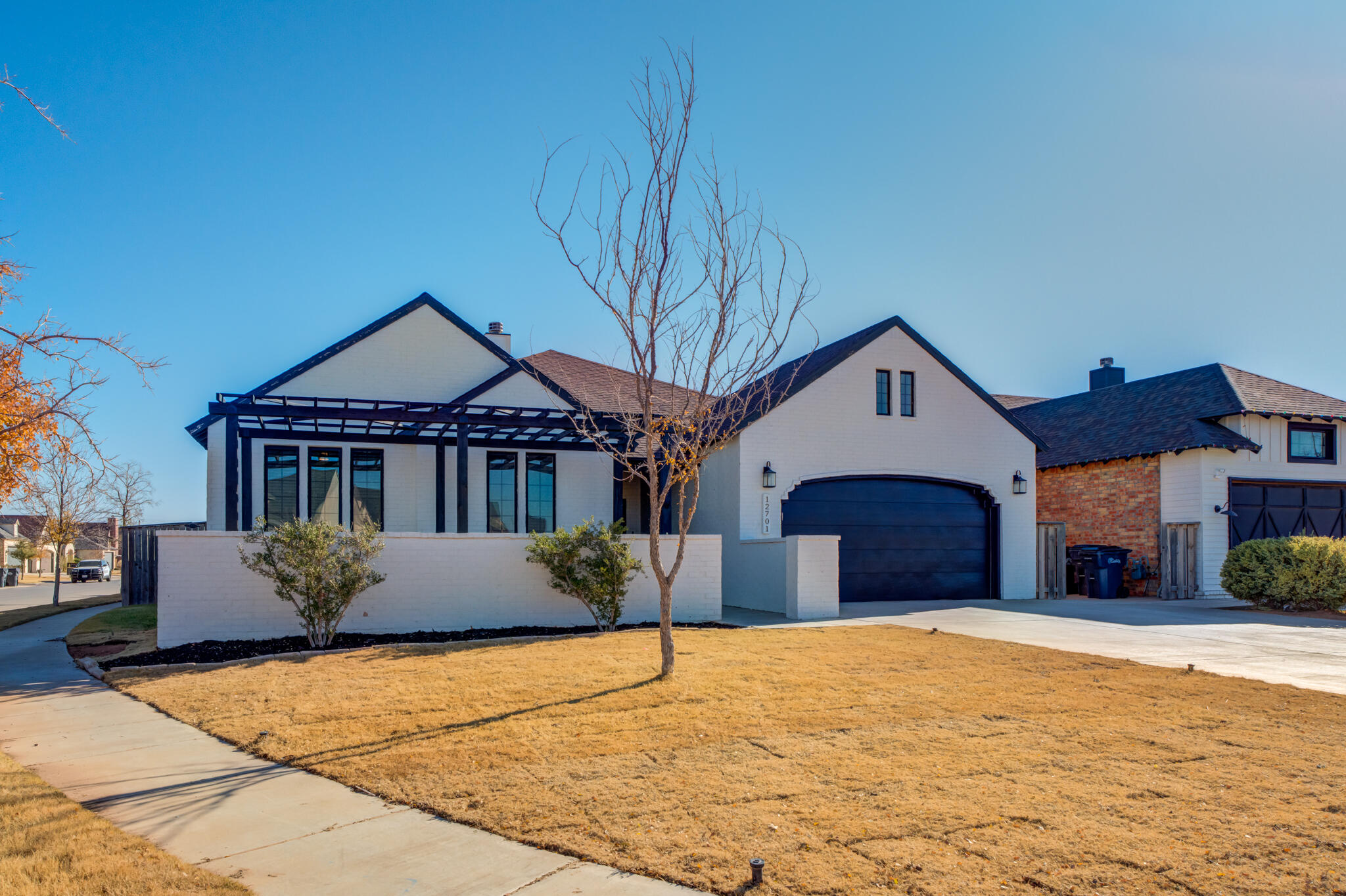 12701 Kenosha Avenue Lubbock, TX 79423 - Photo 3 of 61 a front view of a house with a yard