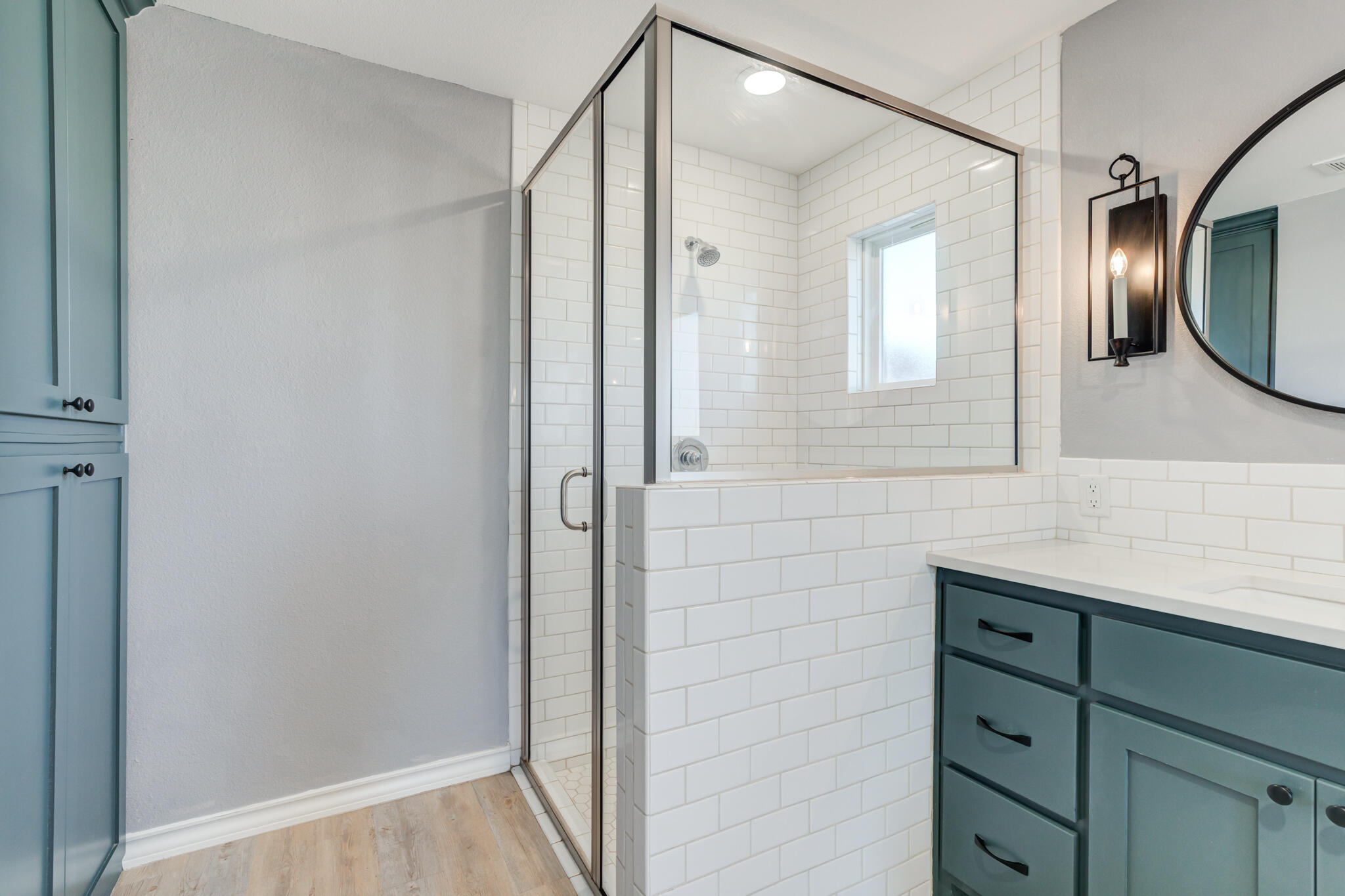 12701 Kenosha Avenue Lubbock, TX 79423 - Photo 38 of 61 a bathroom with a mirror and a shower