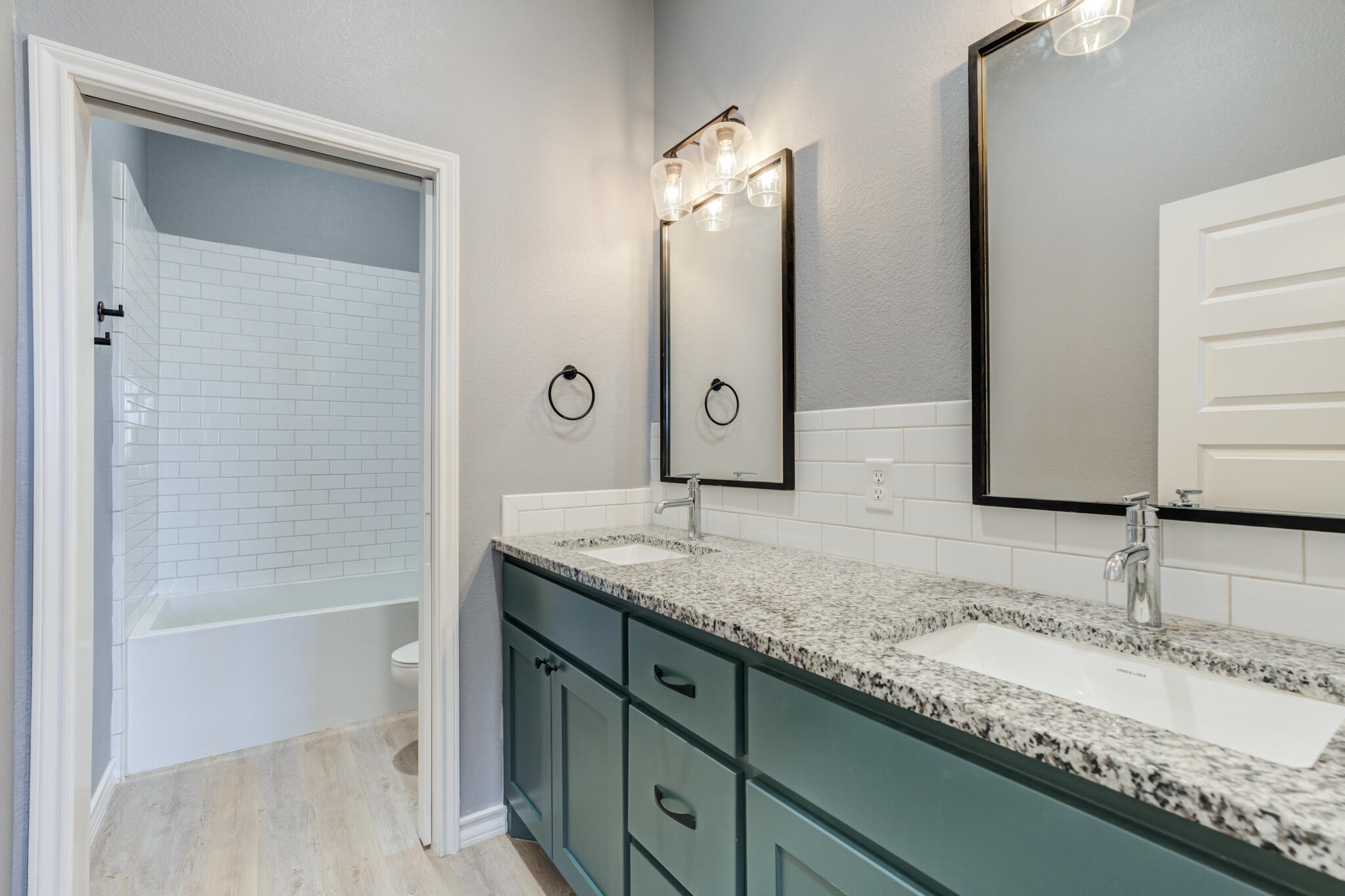 12701 Kenosha Avenue Lubbock, TX 79423 - Photo 49 of 61 a bathroom with a granite countertop sink and a mirror
