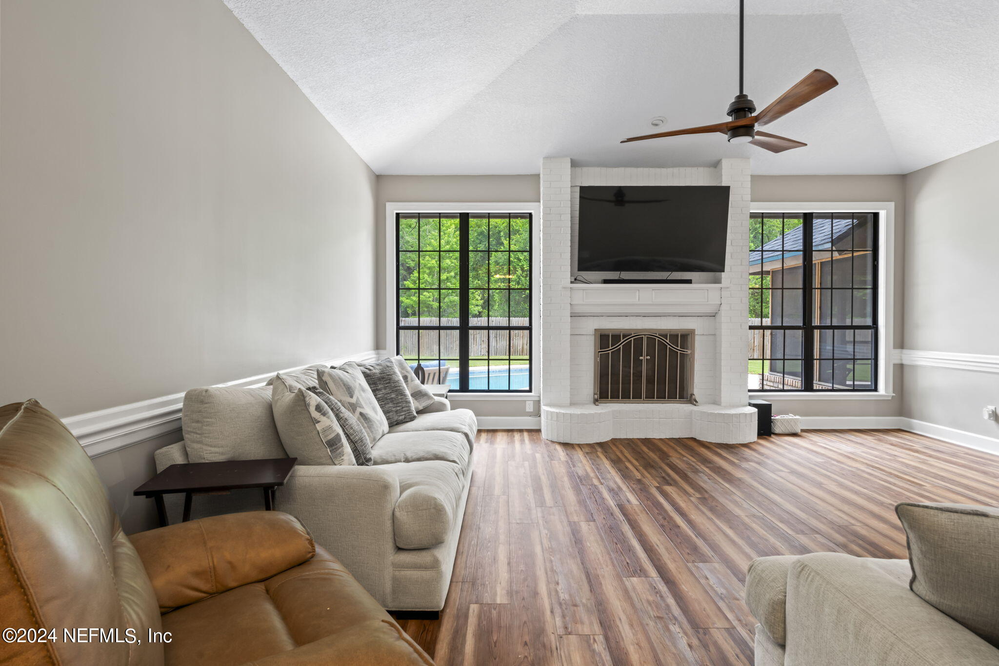 431 Cheryl Court St. Johns, FL 32259 - Photo 11 of 41 a living room with furniture fireplace and flat screen tv