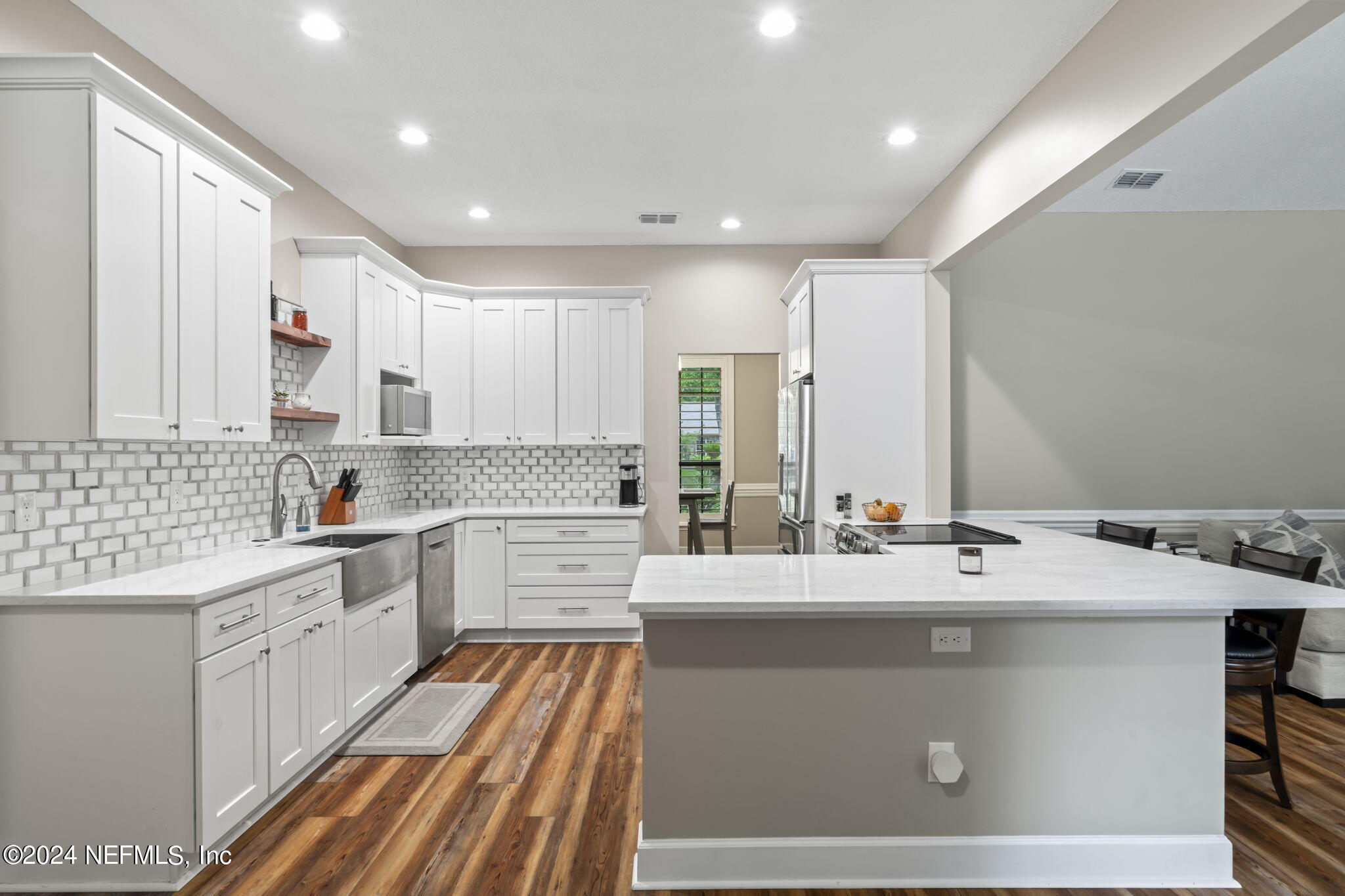 431 Cheryl Court St. Johns, FL 32259 - Photo 14 of 41 a kitchen with a sink stove and cabinets