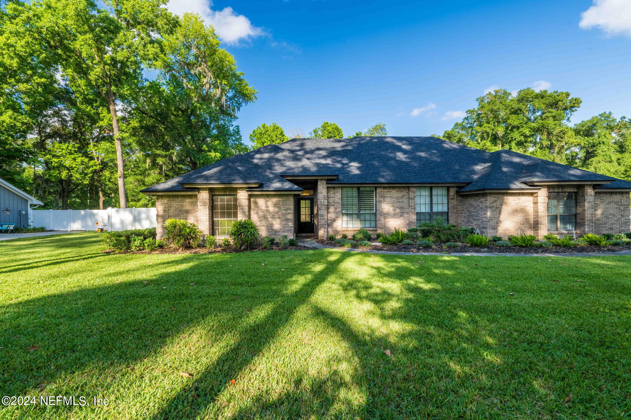 431 Cheryl Court St. Johns, FL 32259 - Photo 26 of 41 a front view of a house with a garden