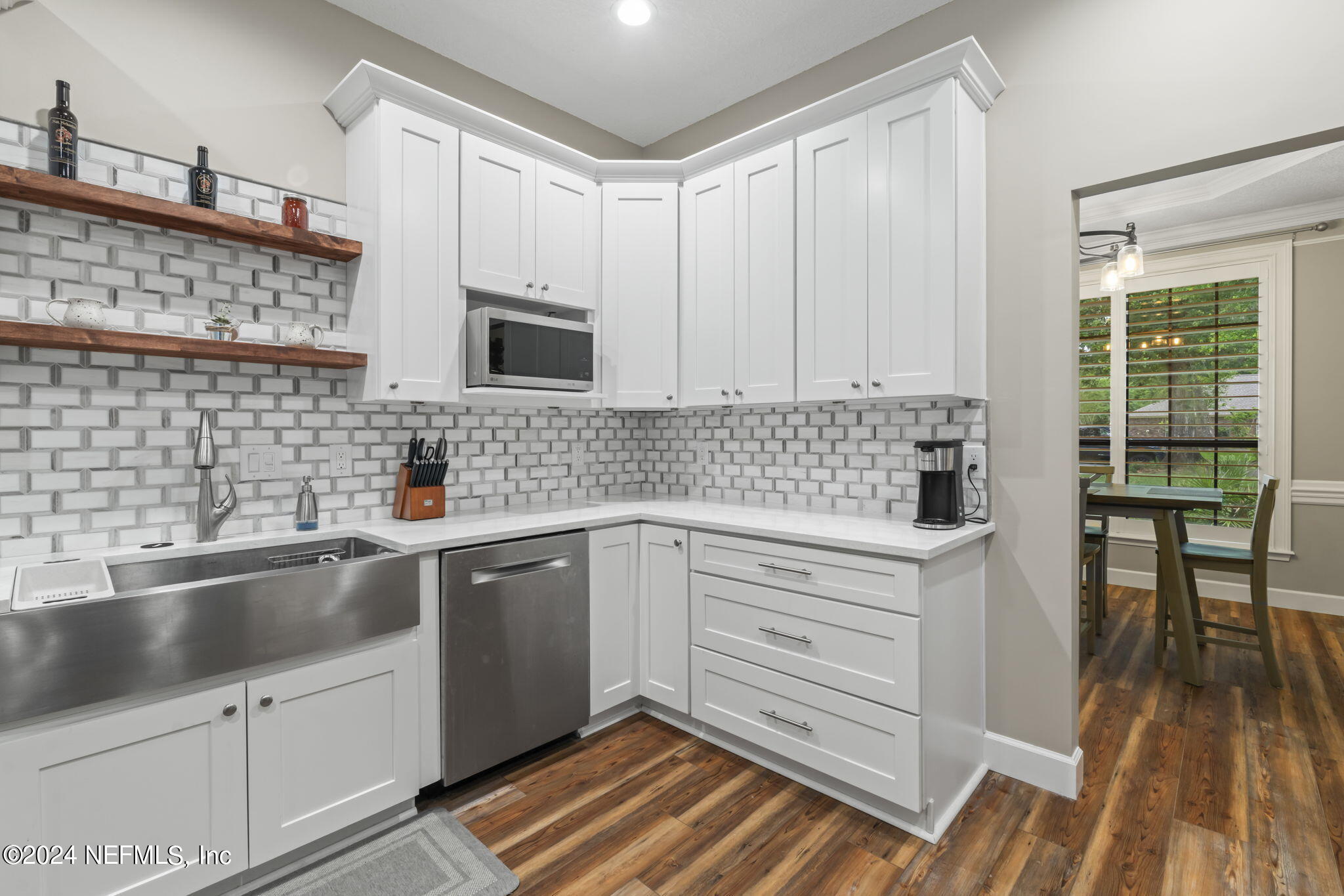431 Cheryl Court St. Johns, FL 32259 - Photo 3 of 41 a kitchen with a sink and cabinets