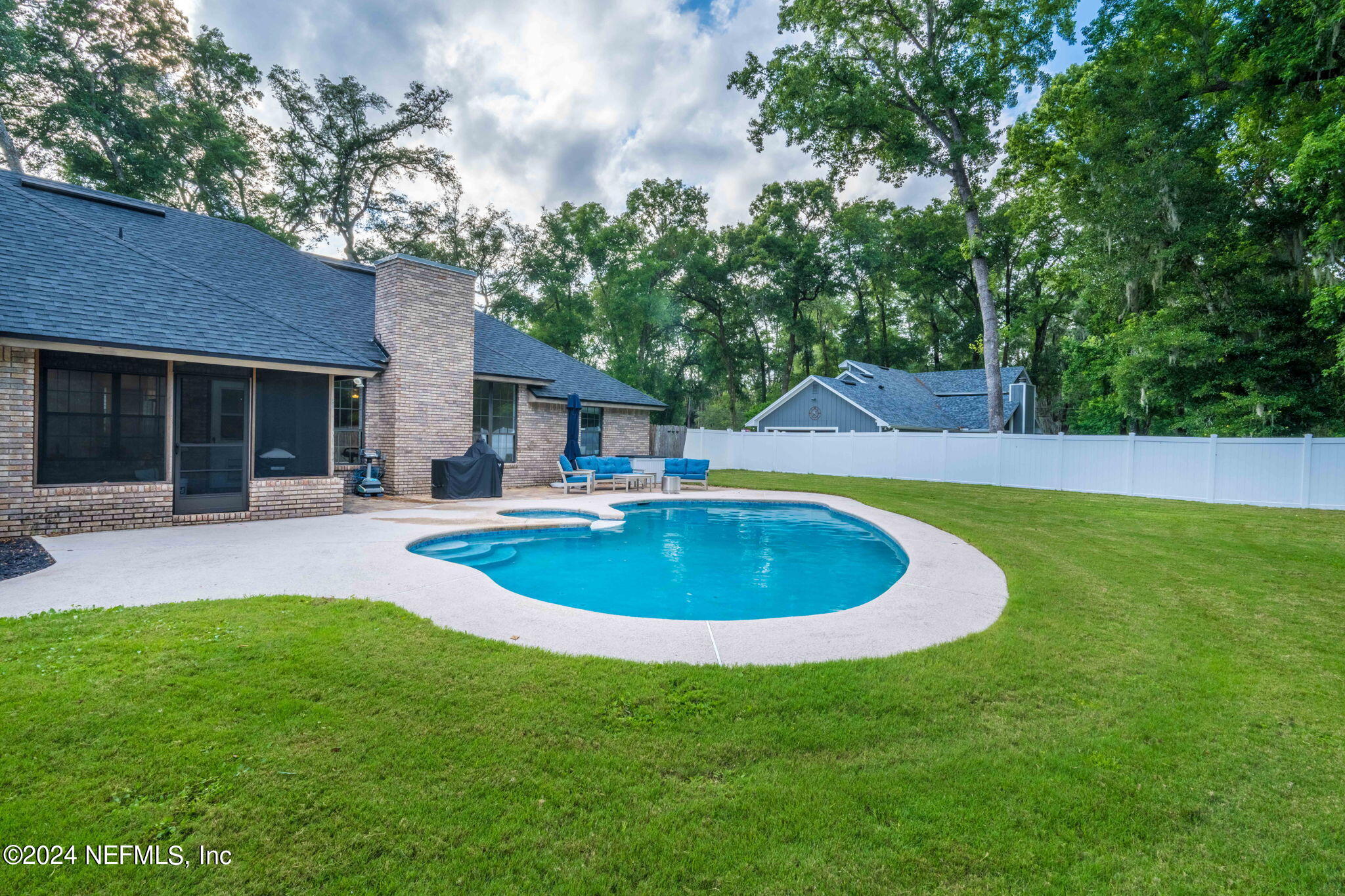 431 Cheryl Court St. Johns, FL 32259 - Photo 34 of 41 a swimming pool with outdoor seating and yard
