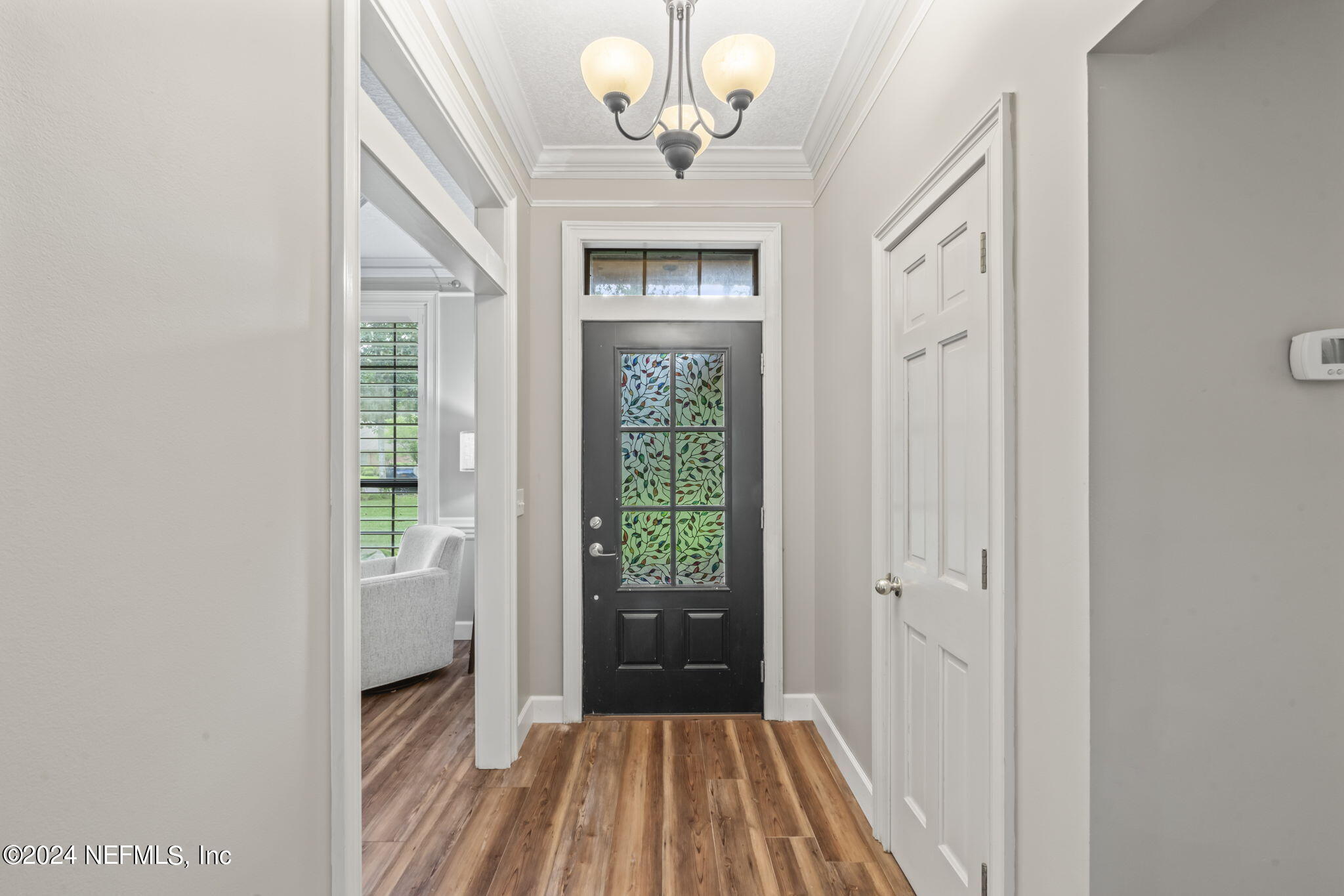 431 Cheryl Court St. Johns, FL 32259 - Photo 6 of 41 a view of a hallway with wooden floor and a bathroom