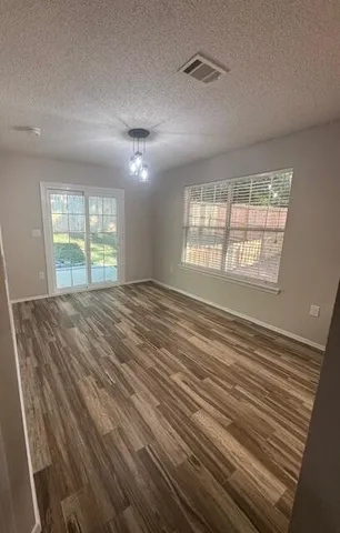 a view of an empty room with a window