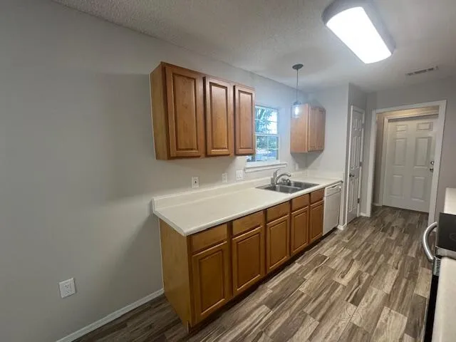 a spacious bathroom with a sink and a mirror