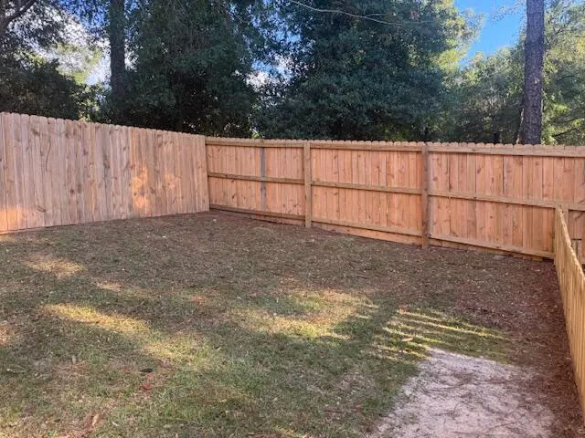 a view of backyard with green space