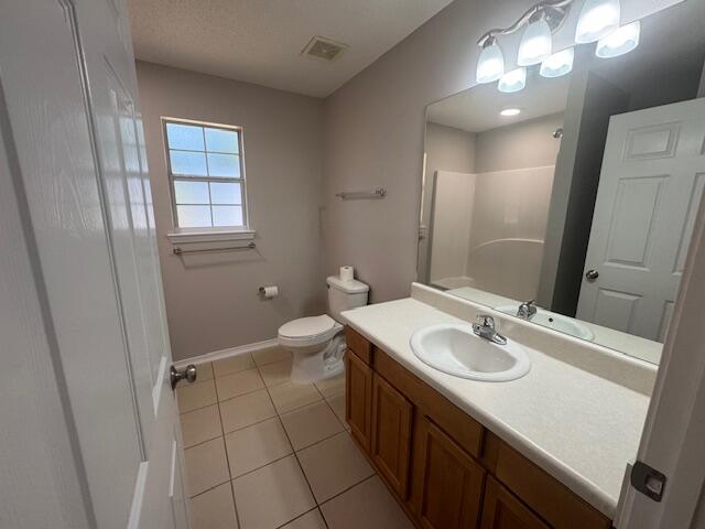 252 Panama Drive Crestview, FL 32536 - Photo 10 of 36 a bathroom with a sink a toilet a mirror and vanity