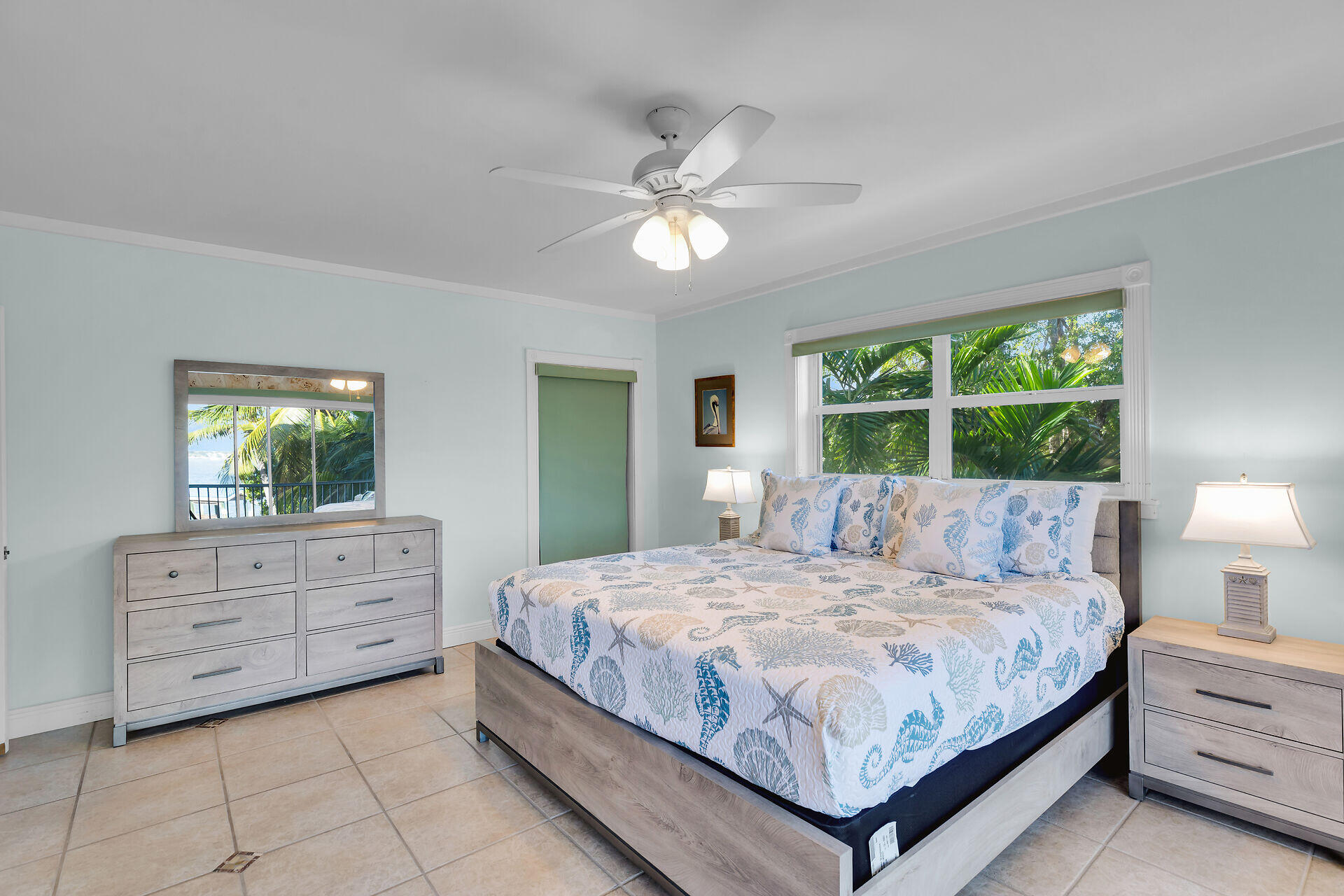 35 Mutiny Place Key Largo, FL 33037 - Photo 28 of 59 a bedroom with a large bed and a chandelier