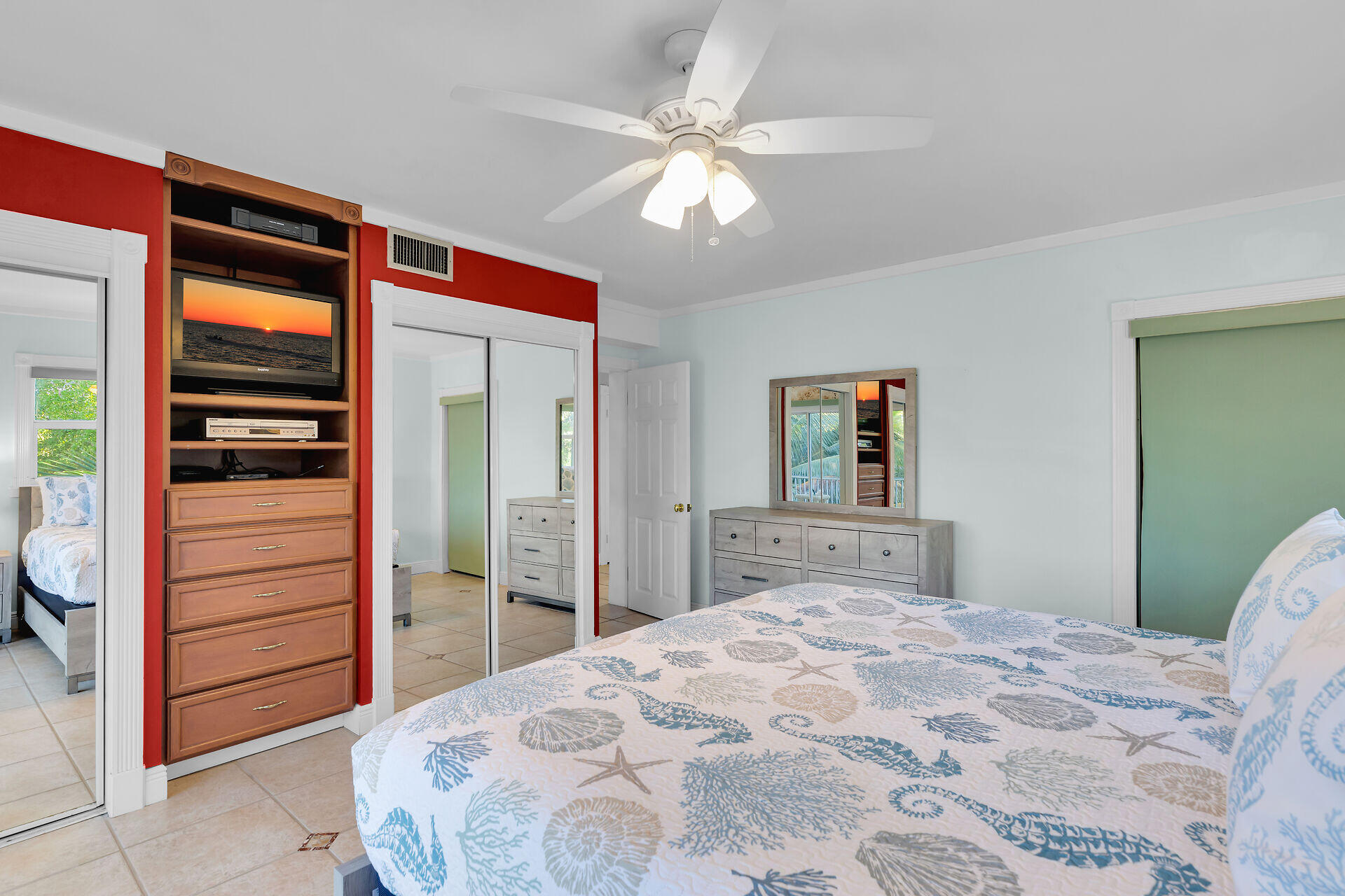 35 Mutiny Place Key Largo, FL 33037 - Photo 29 of 59 a bedroom with a bed and a chandelier
