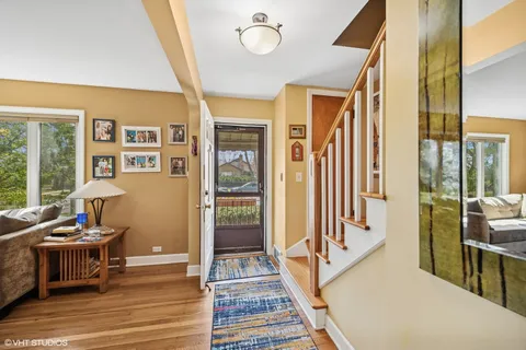 a view of a hallway with furniture and front door