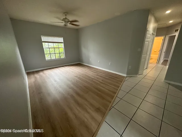 a kitchen with white cabinets appliances and a sink