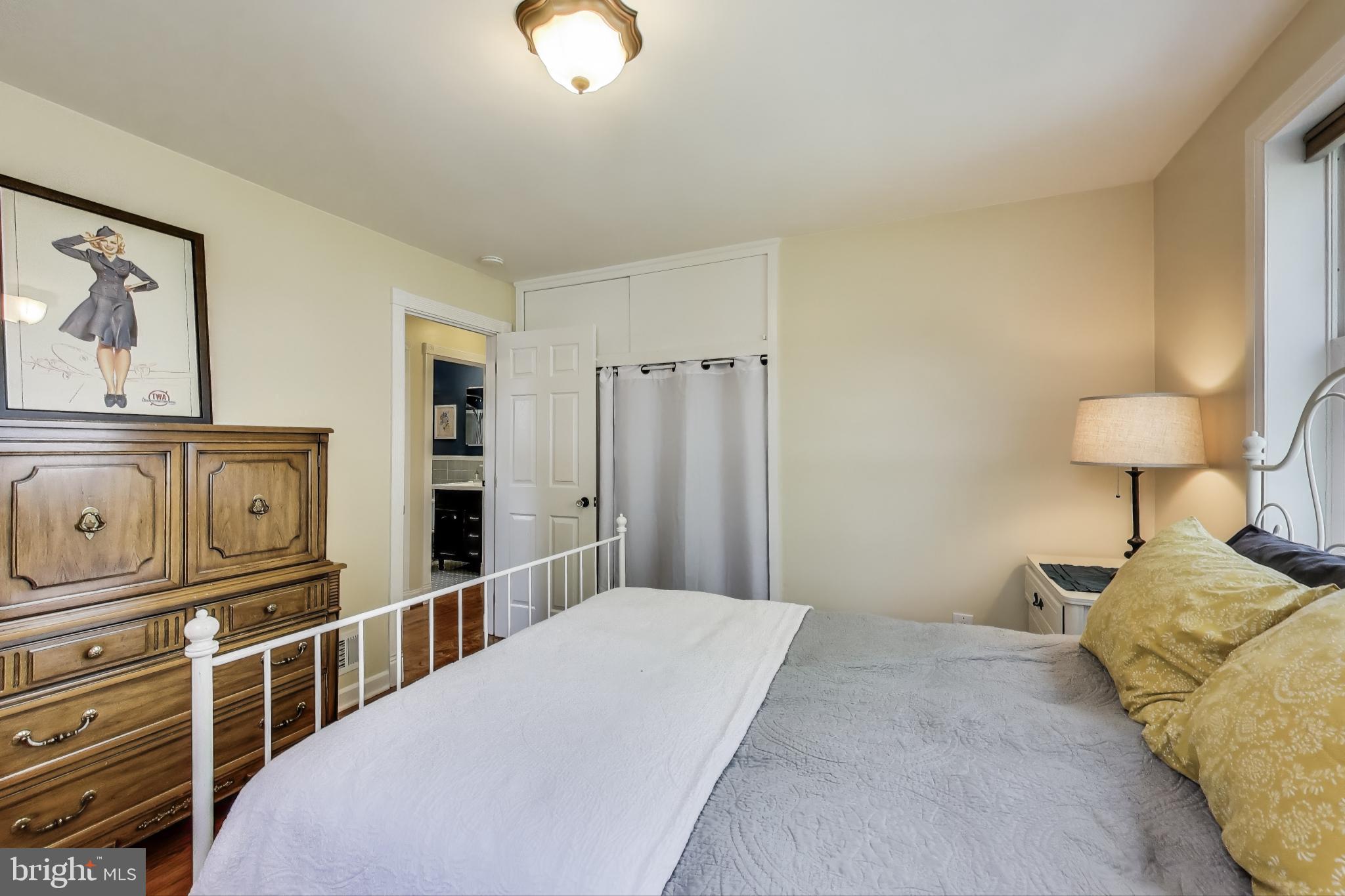 3316 Harrell Street Silver Spring, MD 20906 - Photo 12 of 38 a bedroom with a bed and a chandelier